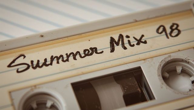 Vintage cassette tape labeled summer mix 98 closeup retro analog reels nostalgia macro warm tones