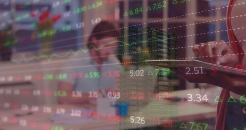 Businesswoman Using Tablet with Financial Data Overlay in Office