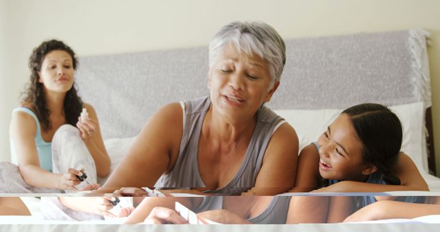 Generational Bonding with Nail Painting on Bed - Download Free Stock Images Pikwizard.com