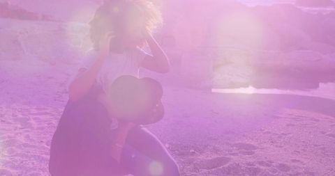 Couple Enjoying Romantic Beach Moment with Smartphone