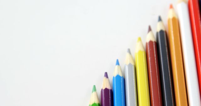 Colorful Colored Pencils Arranged in Diagonal Pattern on White Background - Download Free Stock Images Pikwizard.com