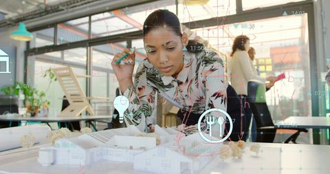 Businesswoman Analyzing Data with Financial Overlay in Office Setting