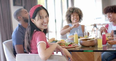 Diverse Friends Enjoying Meal, Celebrating Friendship