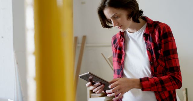 Young Woman Using Tablet in Workspace - Download Free Stock Images Pikwizard.com