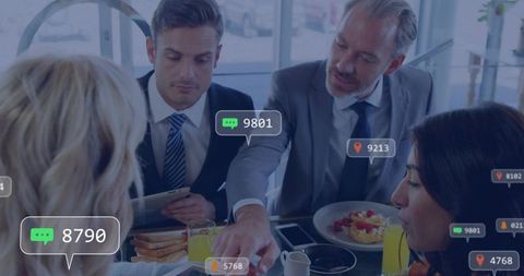 Executive Team Collaborating Over Breakfast With Social Media Analytics Overlays