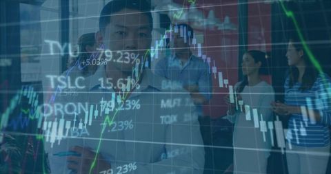 Businessman Analyzing Financial Stock Charts in Office