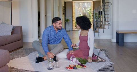 Joyful Couple Bonding Indoors with Playful Moments