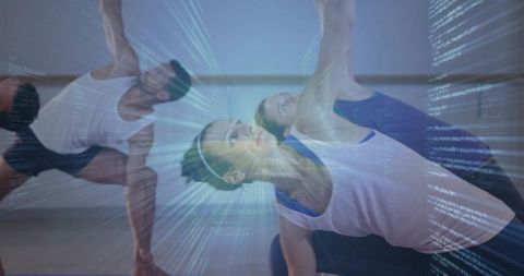 Group practicing side stretch with digital code projection in fitness studio, tech wellness