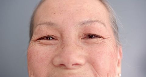 Senior woman with gentle smile displaying wisdom and serenity