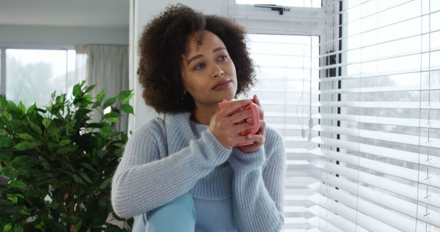 Thoughtful Woman Enjoying Morning Coffee at Home by Window - Download Free Stock Images Pikwizard.com