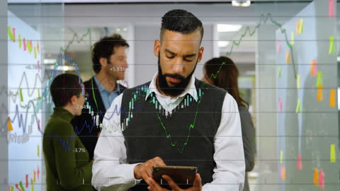 Businessman Analyzing Financial Data on Tablet in Office