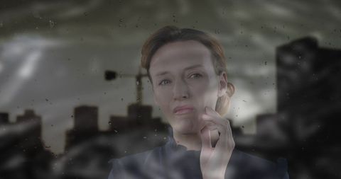 Woman Contemplating Against Urban Background in Overcast Weather