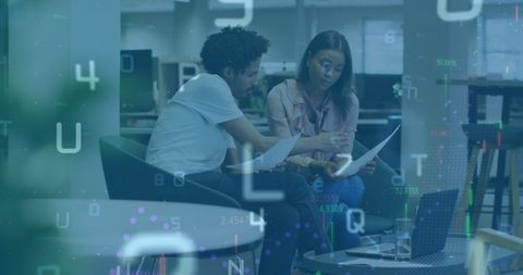 Diverse Coworkers Reviewing Data with Digital Overlay in Modern Office