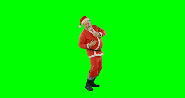 An elderly man dressed as Santa Claus is dancing joyfully against a green screen background. This festive image is ideal for holiday promotion materials, Christmas cards, video overlays, festive advertisements, and digital media. The green screen allows for easy background replacement, making it versatile for various creative projects.