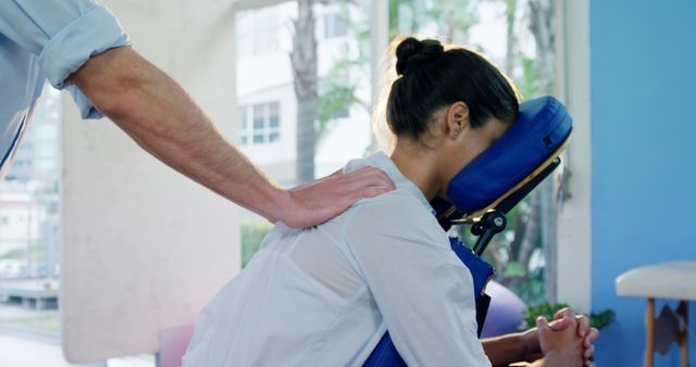 Chiropractor Giving Shoulder Massage to Woman in Office - Download Free Stock Images Pikwizard.com