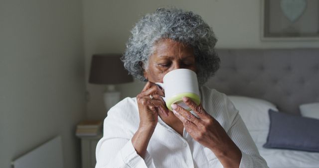 Senior woman enjoying morning coffee at home - Download Free Stock Images Pikwizard.com