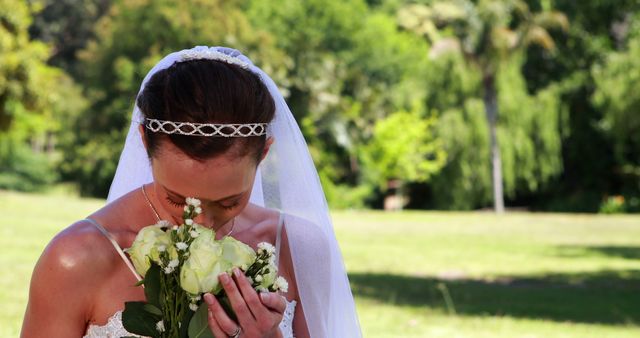 Bride Smelling Bouquet During Outdoors Wedding - Download Free Stock Images Pikwizard.com