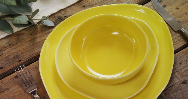 Elegant Yellow Dinnerware Set on Rustic Wooden Table - Download Free Stock Images Pikwizard.com