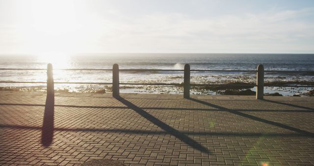 Serene Seaside Boardwalk During Sunset - Download Free Stock Images Pikwizard.com