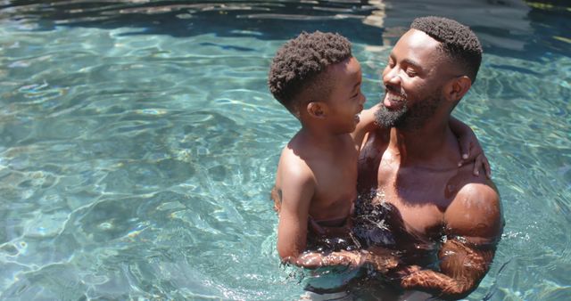 Happy Father and Son Swimming and Bonding in Pool - Download Free Stock Images Pikwizard.com