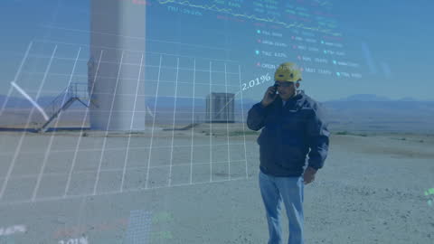 Engineer Analyzing Data at Wind Farm with Futuristic Technology