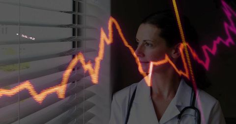 Female physician gazing through blinds with neon data graph overlay showing analysis
