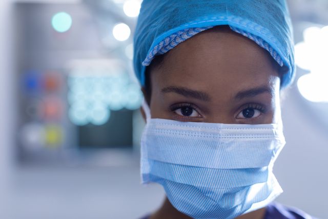 Close-up of young female surgeon standing in operation theater at hospital