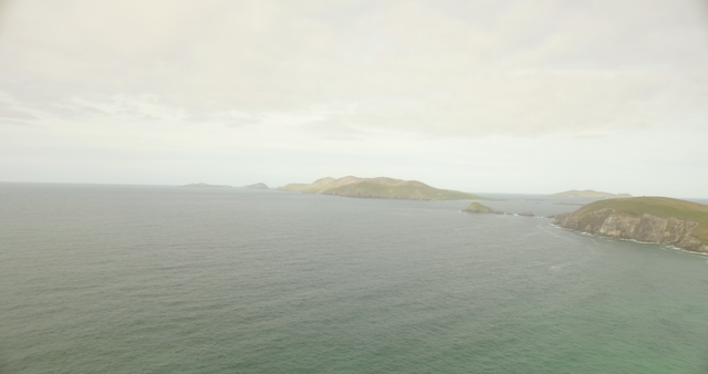 Transparent Idyllic Ocean in Cloudy Weather with Remote Island - Download Free Stock Videos Pikwizard.com