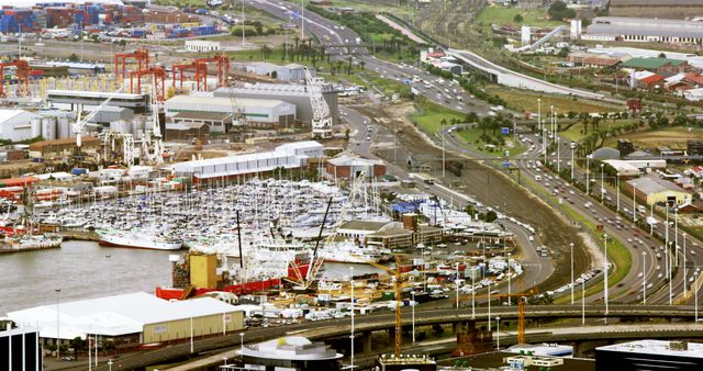 Aerial View of Bustling Industrial Port with Cargo Ships and Boat Marina - Download Free Stock Images Pikwizard.com