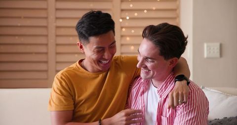Joyful Proposal Moment Between Diverse Gay Couple at Home