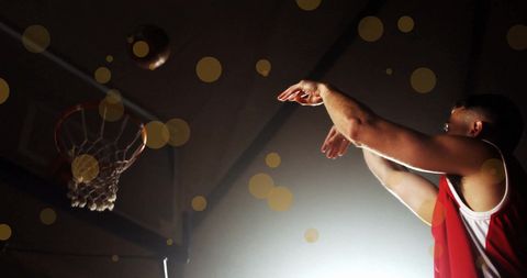 Basketball Player Shooting in Dramatic Lighting with Light Spots - Download Free Stock Images Pikwizard.com