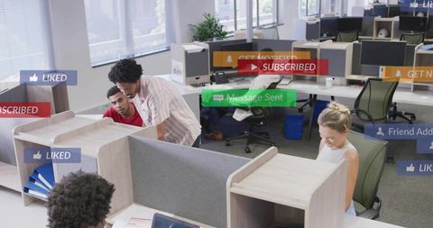 Team collaborating in modern open office with media notifications and workspace interaction
