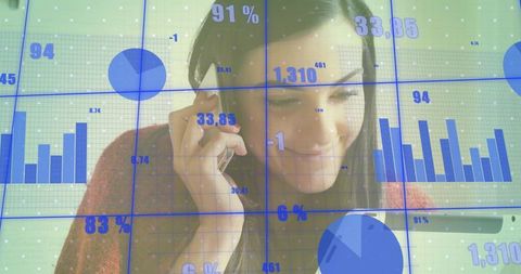 Businesswoman making call while checking tablet viewing blue analytics dashboards