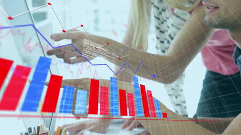 Team Analyzing Business Graphs on Computer for Strategic Planning