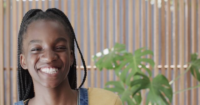 Happy african american girl smiling with face close up at home. Summer, vacations, free time and indoors, unaltered.