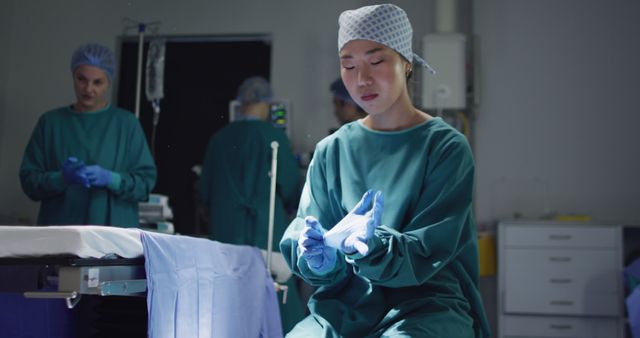 Focused Medical Professional Preparing for Surgery in Operating Room - Download Free Stock Images Pikwizard.com