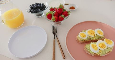 Healthy Breakfast Spread with Avocado Toast and Fresh Fruits