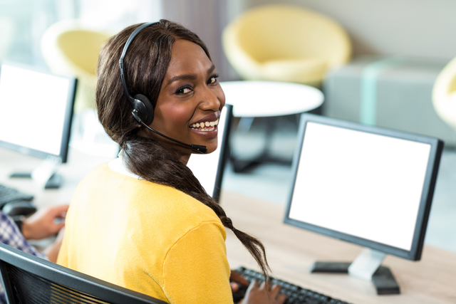 Transparent Smiling Woman Using Computer in Office Setting - Download Free Stock Videos Pikwizard.com