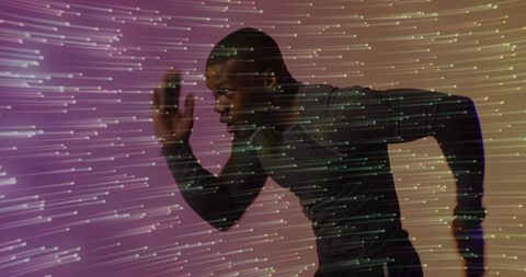 Sprinter Leaning Forward Running Through Digital Light Trails Conveying Speed and Focus