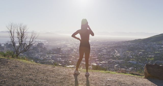 Woman Enjoying Scenic City View During Morning Hike - Download Free Stock Images Pikwizard.com