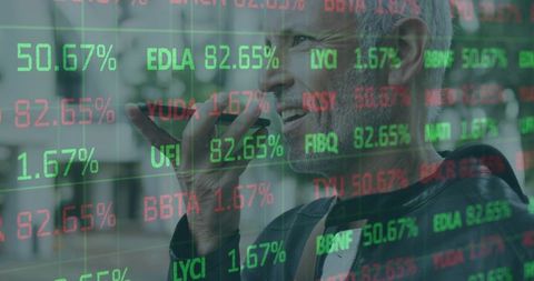 Mature businessman speaking on smartphone with stock market ticker overlay in urban street