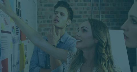 Creative team collaborating on project with visuals