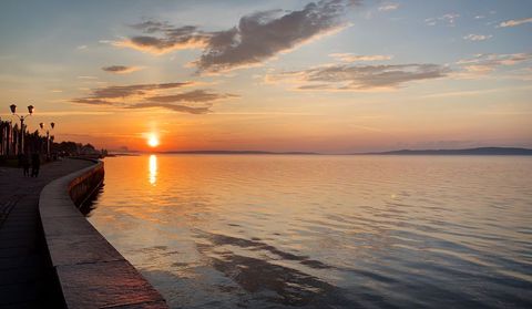 Tranquil beach promenade at sunrise