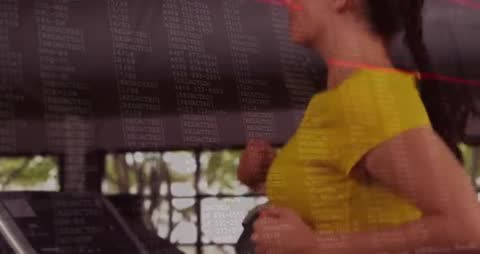 Woman Jogging on Treadmill with Data Visualization