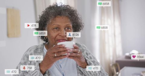Elderly Woman Relaxing with Coffee Amidst Social Media Notifications