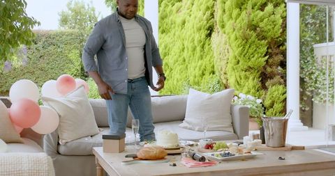 Couple Celebrating on Patio with Drinks and Snacks