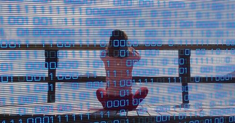 Woman Meditating by Sea with Binary Code Overlay