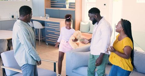 Warm Welcome from Diverse Family in Living Room Gathering