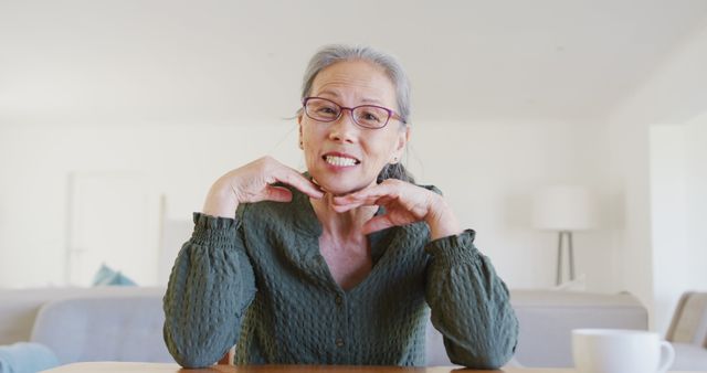 Smiling Senior Woman Wearing Glasses Relaxing Indoors - Download Free Stock Images Pikwizard.com