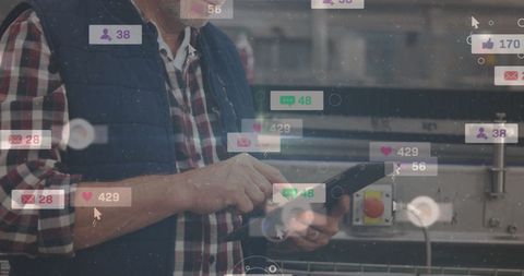 Man Engaging with Social Media Notifications on Tablet